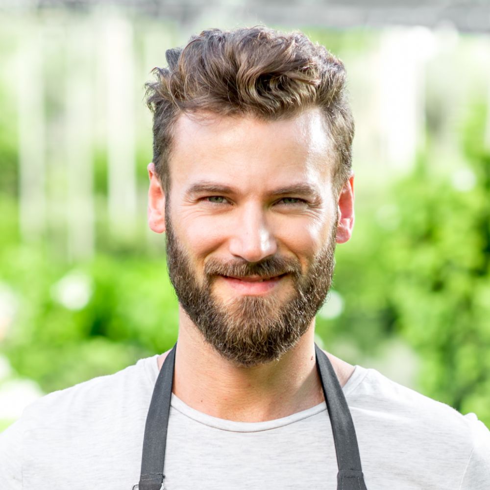 gardener holding pots with plants wue3w2p.jpg